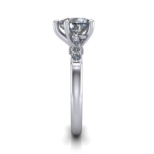 Jimena heart solitaire engagement ring in Platinum, side profile showing the pav&eacute; shoulders, filigree under-gallery, and tapered band