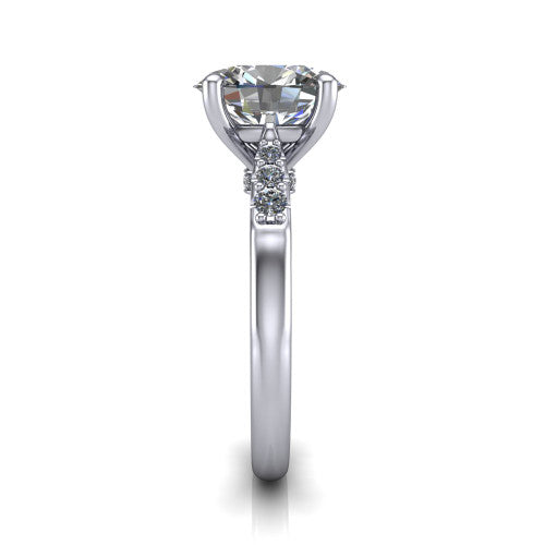Jimena oval solitaire engagement ring in Platinum, side profile showing the pav&eacute; shoulders, filigree under-gallery, and tapered band
