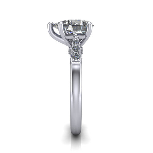 Jimena pear solitaire engagement ring in 18K White Gold, side profile showing the pav&eacute; shoulders, filigree under-gallery, and tapered band