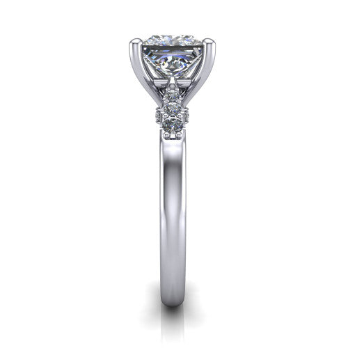 Jimena princess solitaire engagement ring in Platinum, side profile showing the pav&eacute; shoulders, filigree under-gallery, and tapered band