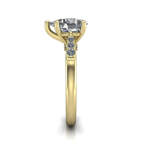 Jimena pear solitaire engagement ring in 14K Yellow Gold, side profile showing the pav&eacute; shoulders, filigree under-gallery, and tapered band