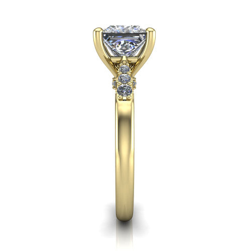 Jimena princess solitaire engagement ring in 14K Yellow Gold, side profile showing the pav&eacute; shoulders, filigree under-gallery, and tapered band