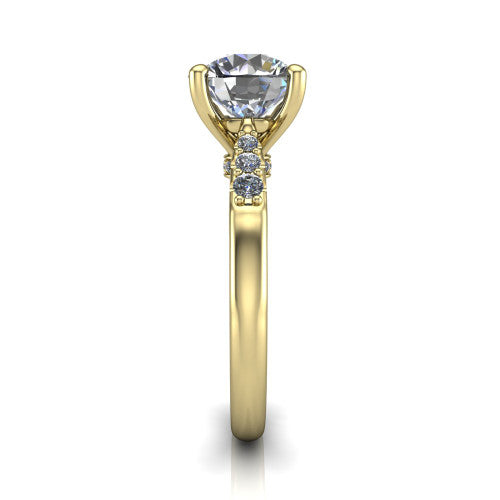 Jimena round solitaire engagement ring in 18K Yellow Gold, side profile showing the pav&eacute; shoulders, filigree under-gallery, and tapered band