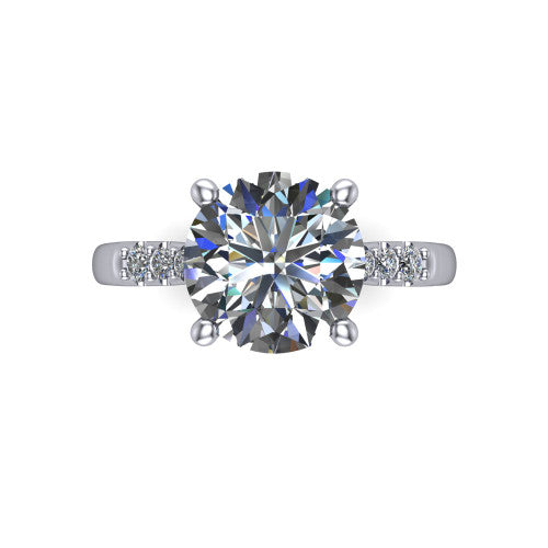 Jimena round solitaire engagement ring in Platinum, top-down view showing the unhaloed round center and the pav&eacute; diamond shoulders