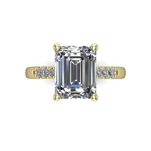 Jimena emerald solitaire engagement ring in 14K Yellow Gold, top-down view showing the unhaloed emerald center and the pav&eacute; diamond shoulders