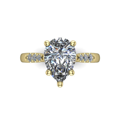 Jimena pear solitaire engagement ring in 14K Yellow Gold, top-down view showing the unhaloed pear center and the pav&eacute; diamond shoulders