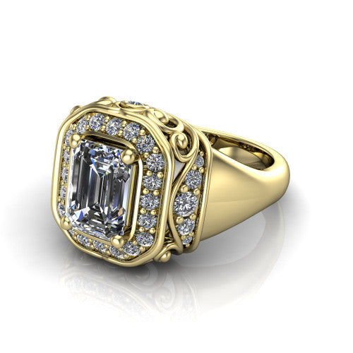 Cassidy emerald vintage halo engagement ring in 18K Yellow Gold, three-quarter perspective showing the emerald center in a double pav&eacute; halo with filigree scrollwork above a plain band