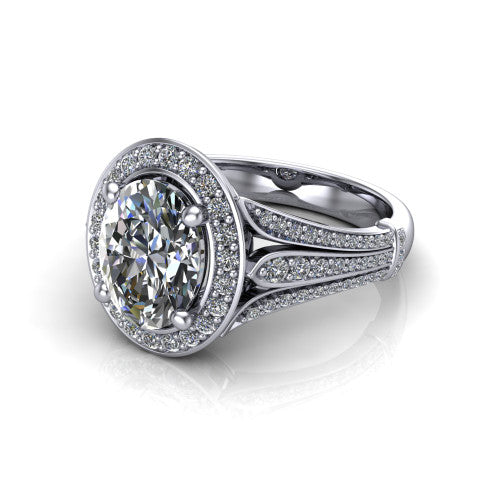 Joy oval halo engagement ring in 18K White Gold, three-quarter perspective showing the oval center in a squared pav&eacute; halo above a pav&eacute; split shank