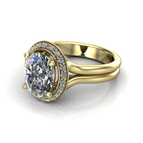 Selah oval halo engagement ring in 18K Yellow Gold, three-quarter perspective showing the oval center in a cushion-shaped pav&eacute; halo above a split shank