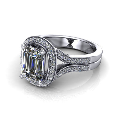 Serena emerald halo engagement ring in Platinum, three-quarter perspective showing the emerald center in a cushion-shaped pav&eacute; halo above a split shank