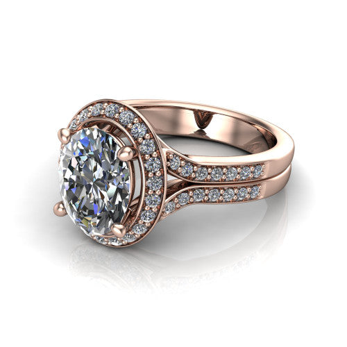 Serena oval halo engagement ring in 18K Rose Gold, three-quarter perspective showing the oval center in a cushion-shaped pav&eacute; halo above a split shank