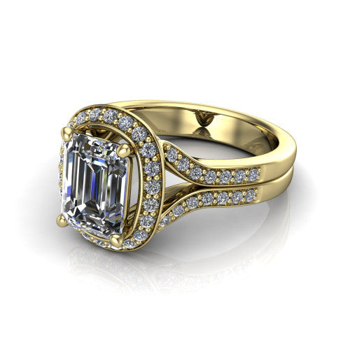 Serena emerald halo engagement ring in 18K Yellow Gold, three-quarter perspective showing the emerald center in a cushion-shaped pav&eacute; halo above a split shank