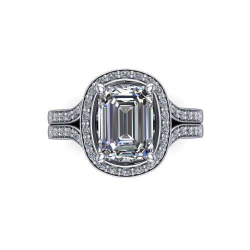 Serena emerald halo engagement ring in Platinum, top-down view showing the cushion-shaped pav&eacute; halo and double-claw prongs framing the emerald center