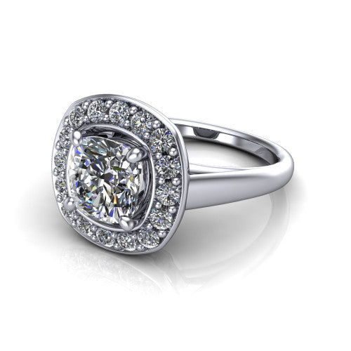 Makenna cushion halo engagement ring in Platinum, three-quarter perspective showing the cushion center in a single pav&eacute; diamond halo above a plain polished band
