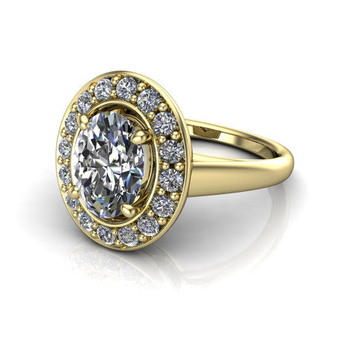 Makenna oval halo engagement ring in 18K Yellow Gold, three-quarter perspective showing the oval center in a single pav&eacute; diamond halo above a plain polished band