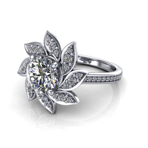 Aurelia round floral halo engagement ring in Platinum, three-quarter perspective showing the center surrounded by pav&eacute; petals radiating like a flower above a pav&eacute; band