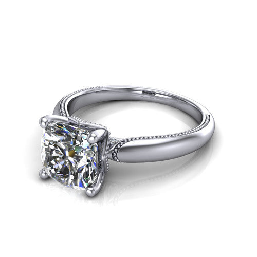 Laila cushion solitaire engagement ring in 18K White Gold, three-quarter perspective showing the double-prong center raised above a milgrain-edged polished band