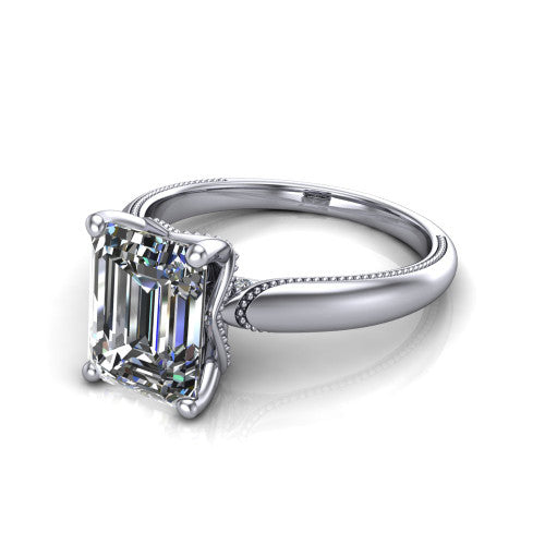 Laila emerald solitaire engagement ring in 18K White Gold, three-quarter perspective showing the double-prong center raised above a milgrain-edged polished band