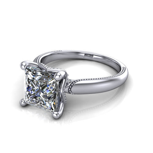 Laila princess solitaire engagement ring in 18K White Gold, three-quarter perspective showing the double-prong center raised above a milgrain-edged polished band