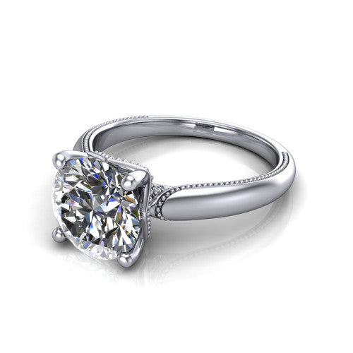 Laila round solitaire engagement ring in 18K White Gold, three-quarter perspective showing the double-prong center raised above a milgrain-edged polished band