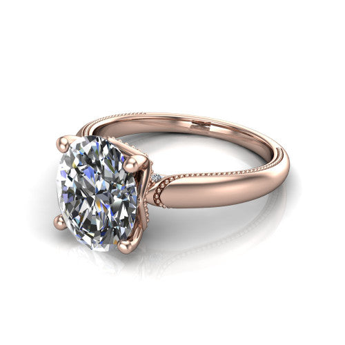 Laila oval solitaire engagement ring in 14K Rose Gold, three-quarter perspective showing the double-prong center raised above a milgrain-edged polished band