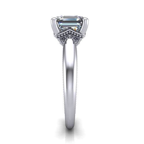 Laila square emerald solitaire engagement ring in Platinum, side profile showing the milgrain detailing running down the polished band in profile