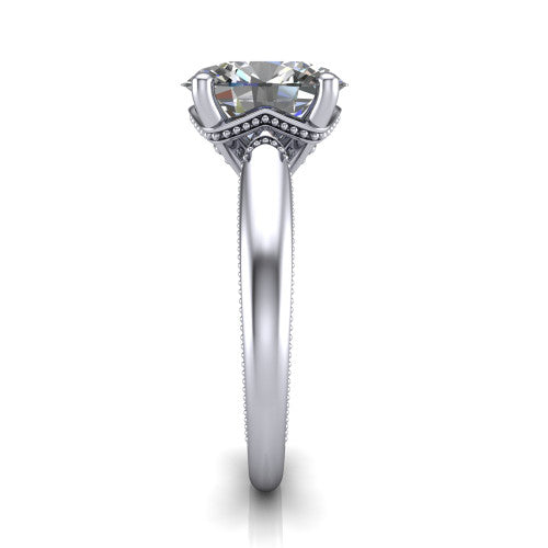 Laila oval solitaire engagement ring in Platinum, side profile showing the milgrain detailing running down the polished band in profile