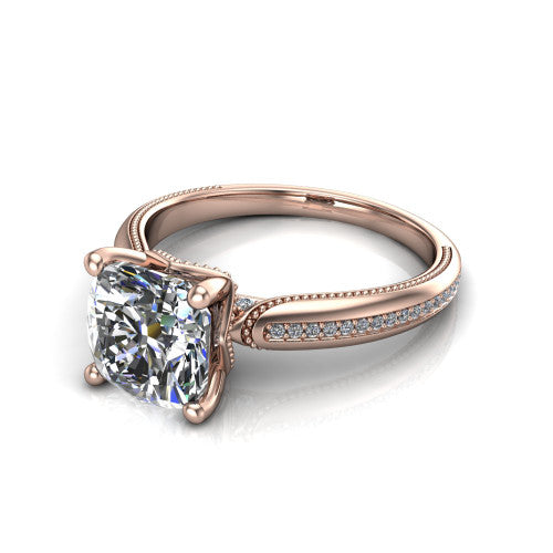 Vanessa cushion solitaire engagement ring in 14K Rose Gold, three-quarter perspective showing the prong-set center raised above a slim pav&eacute; milgrain band