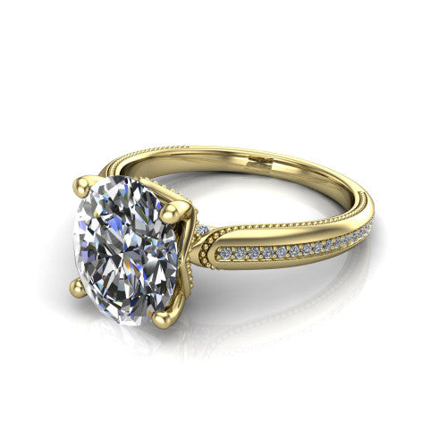 Vanessa oval solitaire engagement ring in 14K Yellow Gold, three-quarter perspective showing the prong-set center raised above a slim pav&eacute; milgrain band