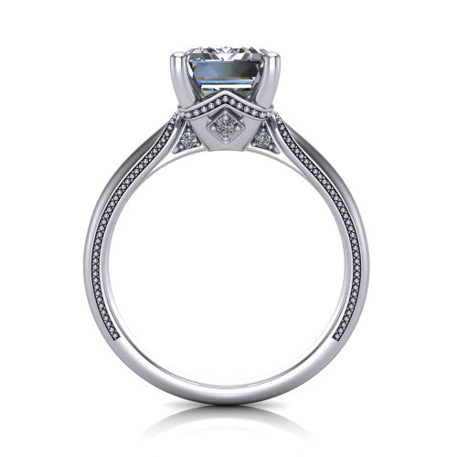 Vanessa emerald solitaire engagement ring in Platinum, through-finger front profile showing the cathedral under-gallery with a diamond accent beneath the center