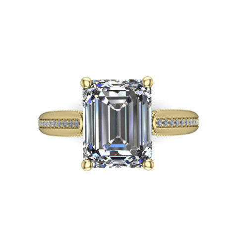 Vanessa emerald solitaire engagement ring in 18K Yellow Gold, top-down view showing the center stone and the pav&eacute; band with milgrain edges from above