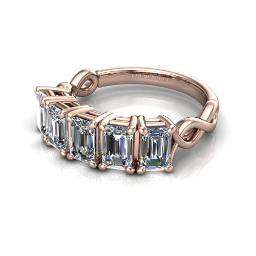 Aitana emerald three stone engagement ring in 18K Rose Gold, three-quarter perspective showing the round center between two round side stones in bar settings on a plain polished band