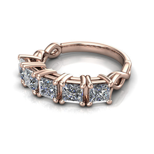 Aitana princess three stone engagement ring in 14K Rose Gold, three-quarter perspective showing the round center between two round side stones in bar settings on a plain polished band