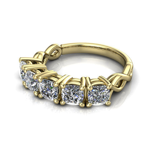 Aitana cushion three stone engagement ring in 14K Yellow Gold, three-quarter perspective showing the round center between two round side stones in bar settings on a plain polished band