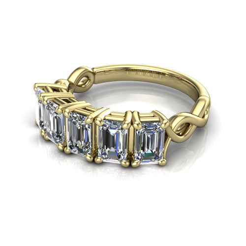 Aitana emerald three stone engagement ring in 14K Yellow Gold, three-quarter perspective showing the round center between two round side stones in bar settings on a plain polished band