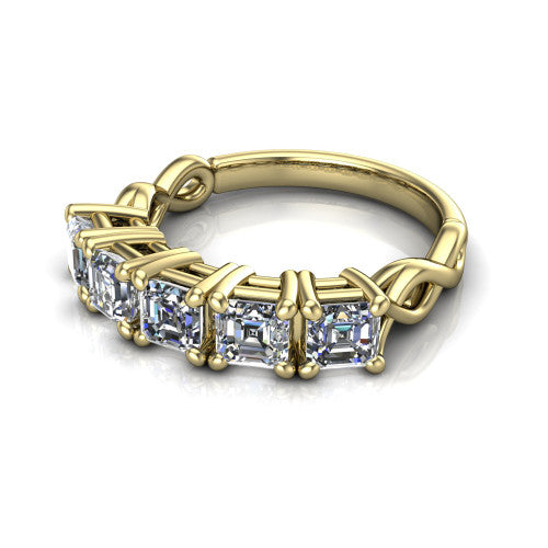 Aitana square emerald three stone engagement ring in 14K Yellow Gold, three-quarter perspective showing the round center between two round side stones in bar settings on a plain polished band