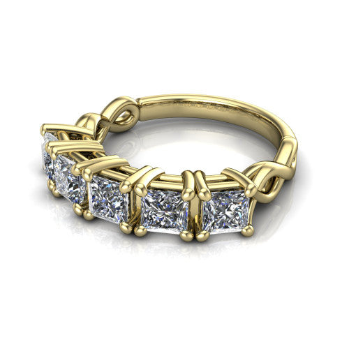 Aitana princess three stone engagement ring in 18K Yellow Gold, three-quarter perspective showing the round center between two round side stones in bar settings on a plain polished band