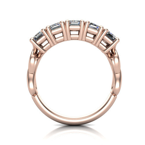 Aitana emerald three stone engagement ring in 18K Rose Gold, through-finger front profile showing the bar-set three-stone head raised above the smooth band