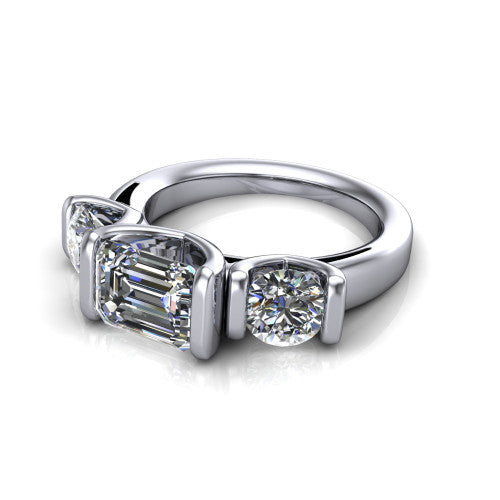 Elianna emerald three stone engagement ring in 18K White Gold, three-quarter perspective showing the round center between two round side stones in bar settings on a plain polished band