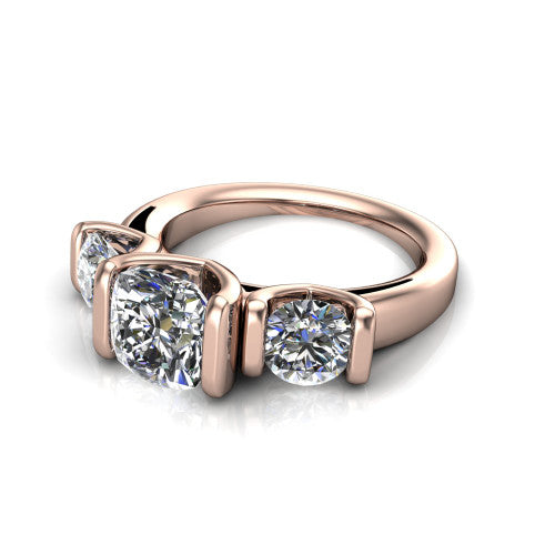 Elianna cushion three stone engagement ring in 18K Rose Gold, three-quarter perspective showing the round center between two round side stones in bar settings on a plain polished band