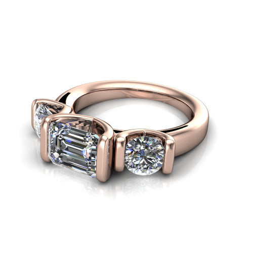 Elianna emerald three stone engagement ring in 14K Rose Gold, three-quarter perspective showing the round center between two round side stones in bar settings on a plain polished band