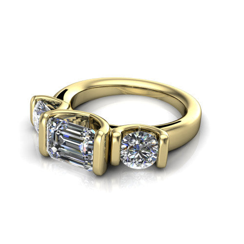 Elianna emerald three stone engagement ring in 14K Yellow Gold, three-quarter perspective showing the round center between two round side stones in bar settings on a plain polished band