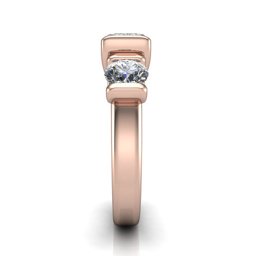 Elianna emerald three stone engagement ring in 14K Rose Gold, side profile showing the plain polished band and the bar-set side stones in profile