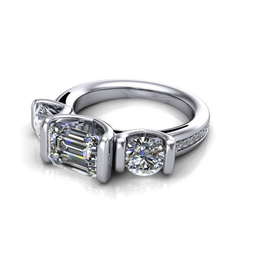 Fatima emerald three stone engagement ring in 14K White Gold, three-quarter perspective showing the round center between two round side stones in bar settings above a pav&eacute; band