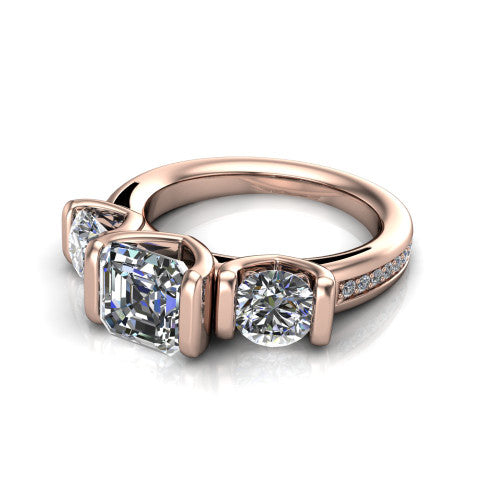 Fatima square emerald three stone engagement ring in 14K Rose Gold, three-quarter perspective showing the round center between two round side stones in bar settings above a pav&eacute; band