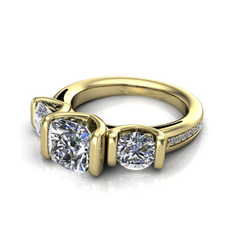Fatima cushion three stone engagement ring in 14K Yellow Gold, three-quarter perspective showing the round center between two round side stones in bar settings above a pav&eacute; band
