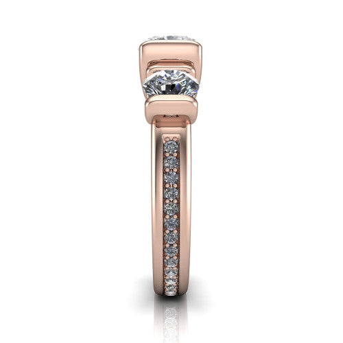 Fatima cushion three stone engagement ring in 18K Rose Gold, side profile showing the pav&eacute; running down the band and the bar-set side stones in profile