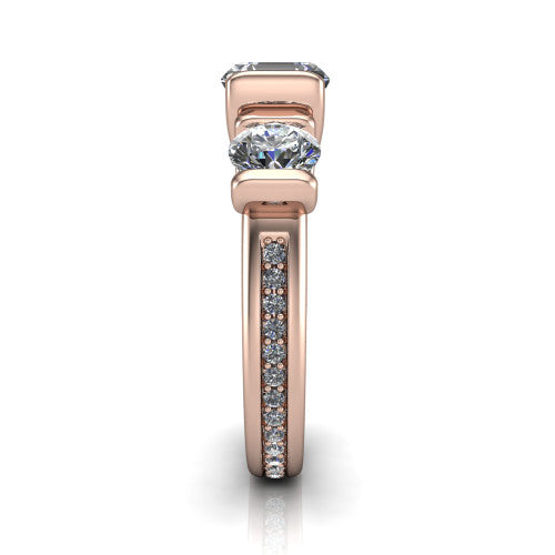 Fatima square emerald three stone engagement ring in 14K Rose Gold, side profile showing the pav&eacute; running down the band and the bar-set side stones in profile