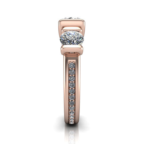 Fatima oval three stone engagement ring in 14K Rose Gold, side profile showing the pav&eacute; running down the band and the bar-set side stones in profile