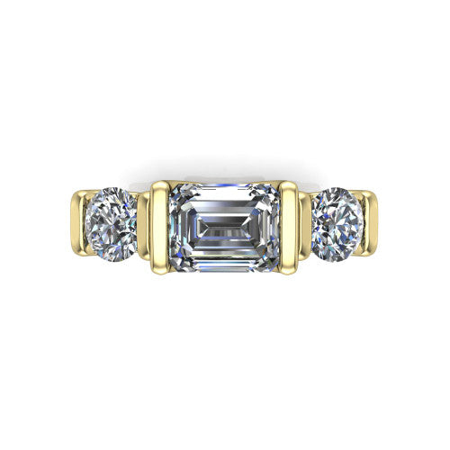 Fatima emerald three stone engagement ring in 14K Yellow Gold, top-down view showing the three round diamonds held in vertical bar settings from above